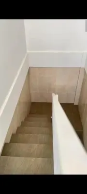 a staircase in a room with a stair case at narayuka house in Seminyak