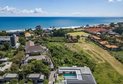 an aerial view of a town with the ocean at Villa Jannu by DreamAwayBali in Seminyak