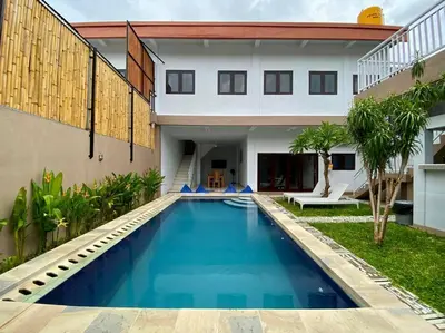a swimming pool in the backyard of a house at Family Villa with Private Pool in Central Seminyak in Seminyak