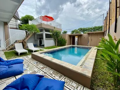a swimming pool in the backyard of a house at Family Villa with Private Pool in Central Seminyak in Seminyak