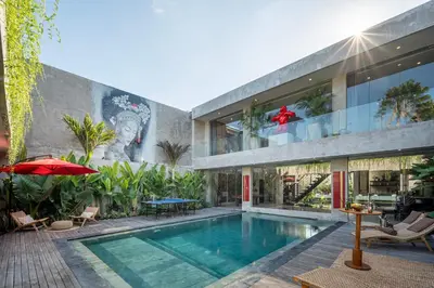 a house with a swimming pool in front of it at Artistic 4BD Villa with Private Pool & Jungle Vibes in Seminyak