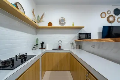a kitchen with a sink and a stove at Ageta Villa 3 bedrooms Umalas with pool in Kerobokan