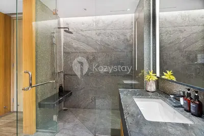 a bathroom with a shower and a sink at Moriya by Kozystay - Nusa Dua in Nusa Dua