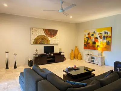 a living room with a couch and a tv at 2bedroom Apartment Petitenget Beach in Seminyak