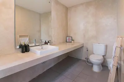 a bathroom with a sink and a toilet at Volare villa in Seminyak