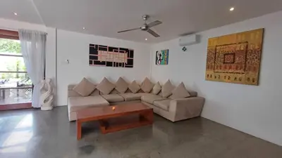 a living room with a couch and a coffee table at Villa Isabella in Seminyak
