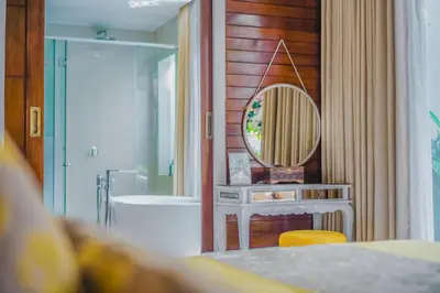 a bathroom with a sink and a mirror at Anari Villas Kuta by The Wina Resorts in Legian