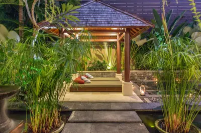 a gazebo in the middle of a garden at Villa Sedap Malam - Private 2 Bedroom Villa Near Seminyak Beach in Kuta