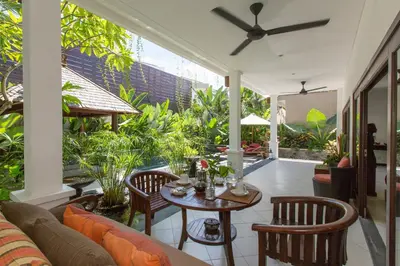 a living room with a couch and a table at Villa Sedap Malam - Private 2 Bedroom Villa Near Seminyak Beach in Kuta