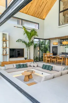 a living room with a couch and a table at Villa Bayu by GORO in Canggu