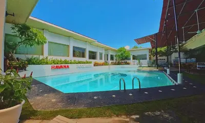 a swimming pool in front of a house at Private Pool Villas Kuta Bali in Kuta