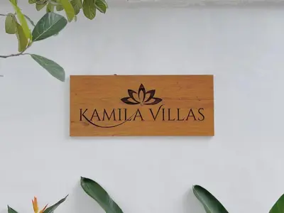 a sign that reads kamila villas on a wall at Kamila Villas 2BR Private Pool Seminyak Central in Seminyak