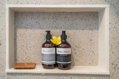 two bottles of wine sitting on a shelf at Umaliving Villa Seminyak Bali in Seminyak