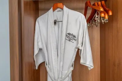 a white shirt hanging on a door with carrots at Umaliving Villa Seminyak Bali in Seminyak