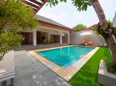 a swimming pool in the backyard of a villa at Near Beach Villa in Seminyak
