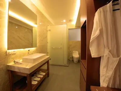 a bathroom with a sink and a mirror at Near Beach Villa in Seminyak