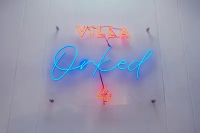 a neon sign that says villetta ginger on a wall at Villa Orked 4 with 12 meter pool in Seminyak