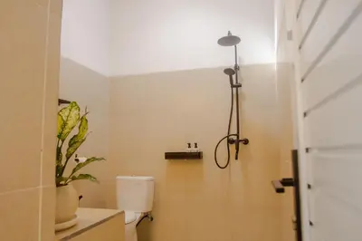 a bathroom with a toilet and a shower at Villa Orked 4 with 12 meter pool in Seminyak