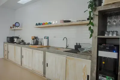 a kitchen with wooden cabinets and a counter top at Villa Orked 4 with 12 meter pool in Seminyak