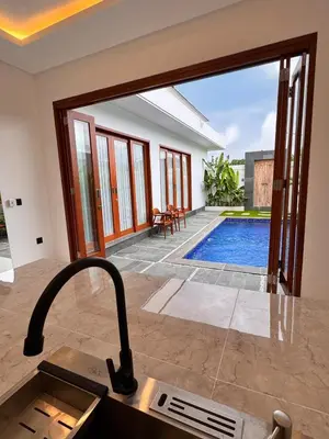 a kitchen with a view of a swimming pool at Private Escape in Seminyak in Seminyak
