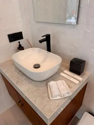 a bathroom with a white sink on a counter at Private Escape in Seminyak in Seminyak