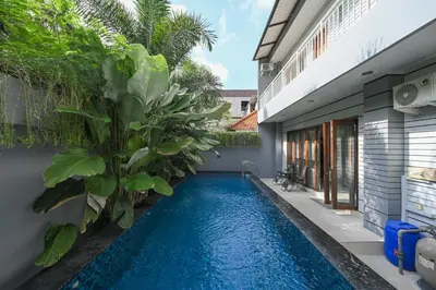 a swimming pool in the backyard of a house at Puri Ratu Jimbaran with Private Pool in Jimbaran