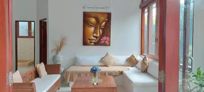 a living room with a couch and a table at Seminyak great Location Villa in Seminyak