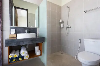 a bathroom with a sink and a toilet at Villa Bteega sawah in Seminyak
