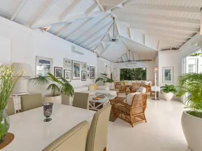 a living room with white walls and a ceiling at Villa Lulito in Seminyak