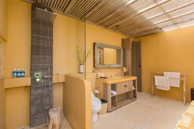 a bathroom with a toilet and a sink and a shower at Villa Sky Li by Nagisa Bali in Seminyak