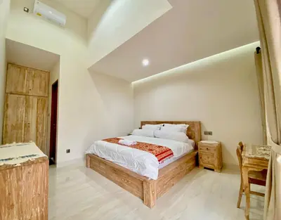 a bedroom with a large bed in a room at Villa Sanur 3 in Sanur
