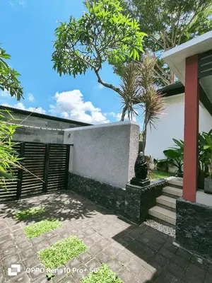 a house with a gate and a stairway at Maya Kori Villa in Jimbaran