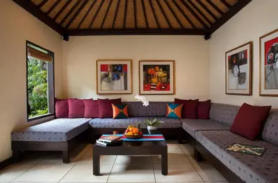 a living room with couches and a table at Villa Dewata II in Seminyak