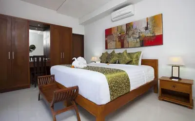 a bedroom with a large bed in a room at Villa Rendezvous Bali in Seminyak