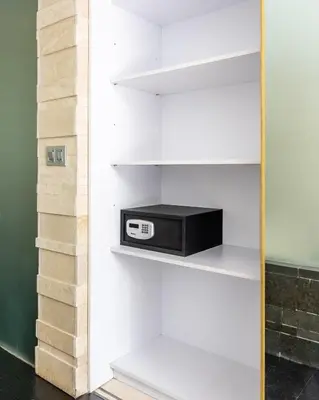 a small microwave sitting on a shelf in a closet at Modern 2BR Villa with Private Pool Prime Location in Seminyak