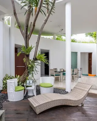 a living room with a couch and a tree at Modern 2BR Villa with Private Pool Prime Location in Seminyak