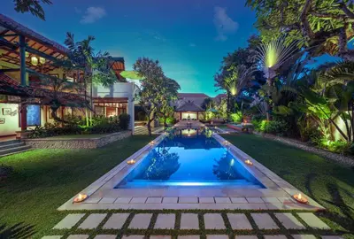 an exterior view of a house with a swimming pool at Villa Mata Budha Seminyak in Seminyak