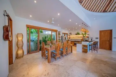 a dining room and living room with a table and chairs at Villa Lea Luxury Oasis in Seminyak Umalas with private pool 4BR in Seminyak