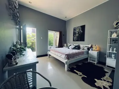 a bedroom with a bed and a window at Gladstudio BrandNew in Kerobokan