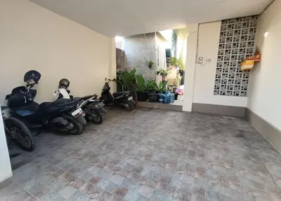 a group of motorcycles parked in a garage at Room Hangtuah Sanur in Kuta