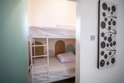 a small bedroom with a bunk bed in it at House Jimbaran Kuta 3 bedroom 8 pax SukaBali 6 in Jimbaran