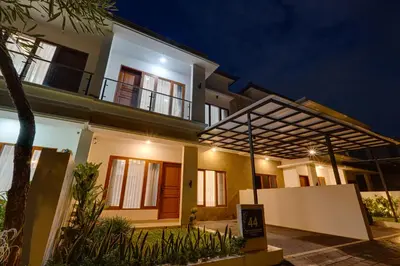a house with a lit up facade at night at Villa Taman Seminyak 44 near Double Six Beach in Seminyak