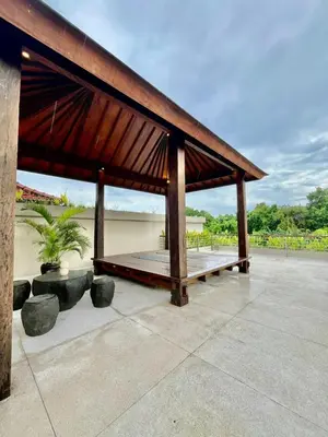 a pavilion with a roof on a patio at 2 BR Villa Near Seminyak Beach in Seminyak