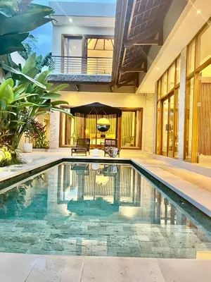 a swimming pool in the middle of a house at 2 BR Villa Near Seminyak Beach in Seminyak