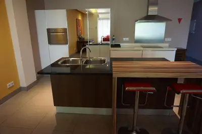 a kitchen with a sink and a counter at Peninsula Bay Resort in Nusa Dua