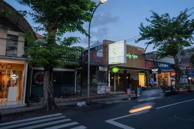 a city street with shops and a crosswalk at The Mupu Seminyak in Seminyak