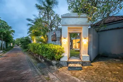 a building with a door on the side of a street at Villa Kangaroo Seminyak next to double six beach in Seminyak