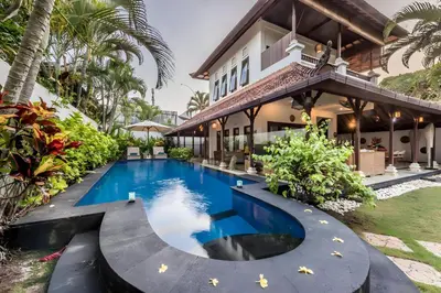 an image of a swimming pool in front of a house at Villa Panda Seminyak next to KU DE TA Beach Club in Seminyak