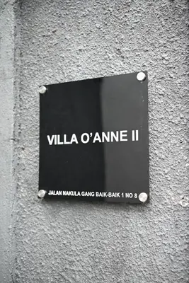 a sign on the side of a building at Villa O'Anne II in Seminyak