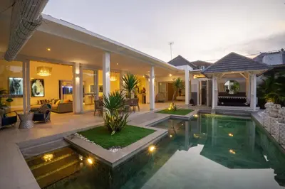 a house with a swimming pool in the yard at Bali Modern Escape With Private Pool, 8 guests in Kerobokan